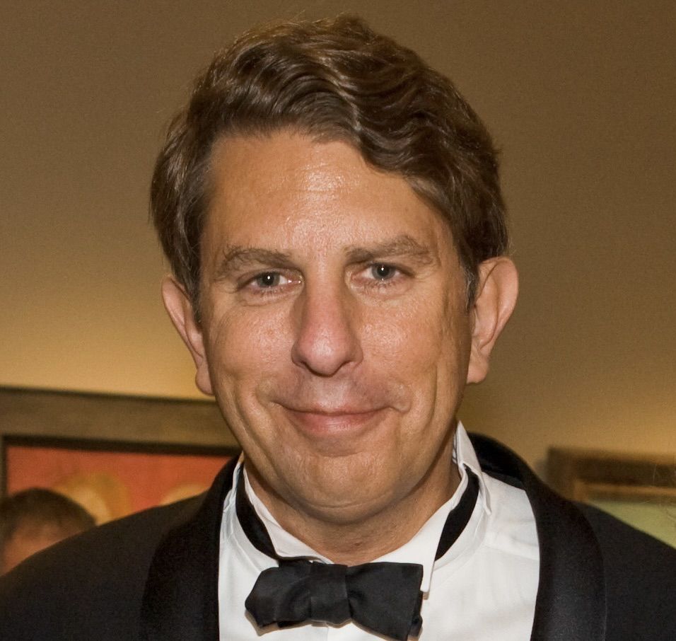 A headshot of Larry Feinberg in a tuxedo with a bow tie